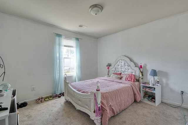 bedroom with carpet, visible vents, and baseboards