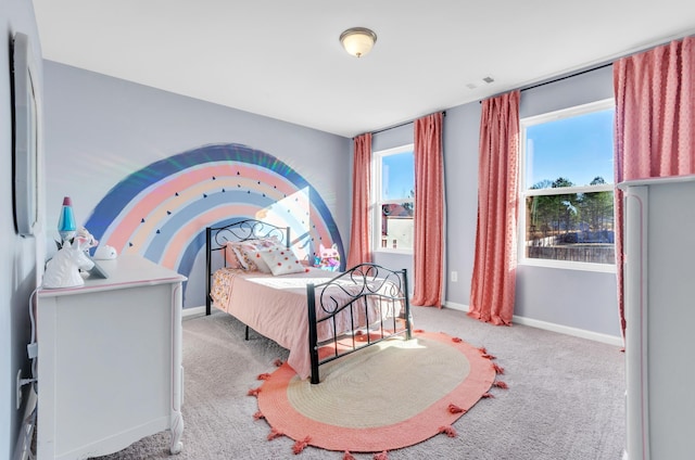 carpeted bedroom featuring visible vents and baseboards