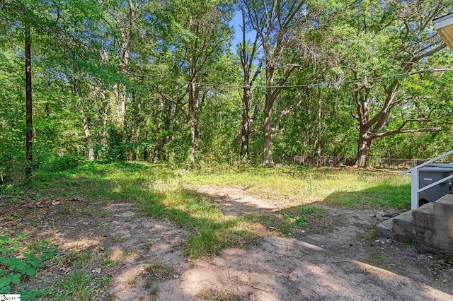 view of yard with a forest view