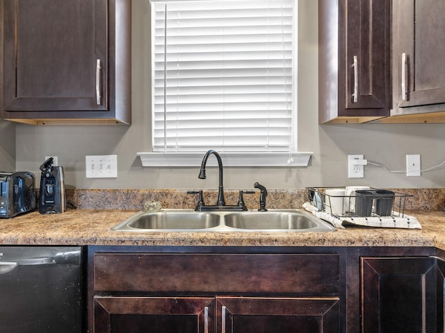 kitchen with a sink, dark brown cabinets, dishwasher, and light countertops