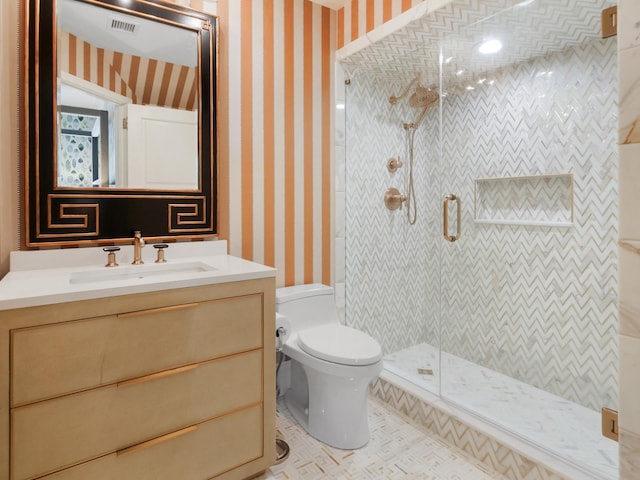 full bathroom with a stall shower, toilet, and wallpapered walls