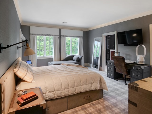 carpeted bedroom featuring visible vents, crown molding, and baseboards