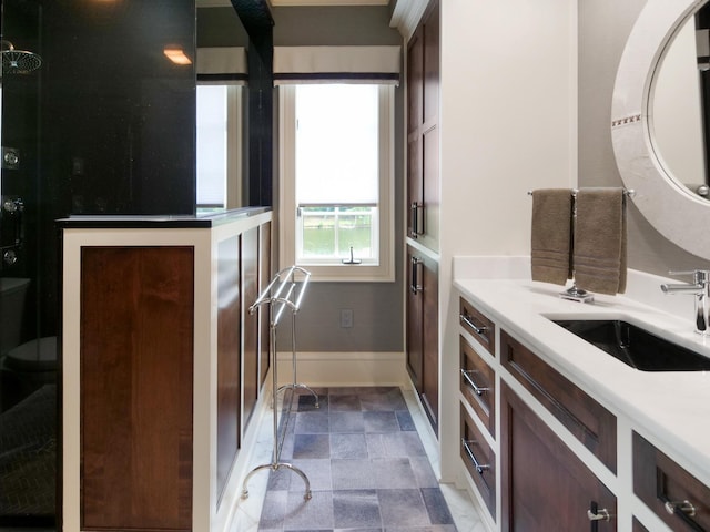 interior space with vanity and baseboards