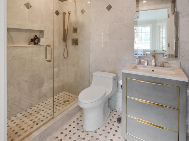 bathroom featuring a stall shower, tile walls, and toilet