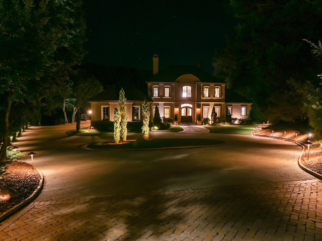 view of front of property with decorative driveway