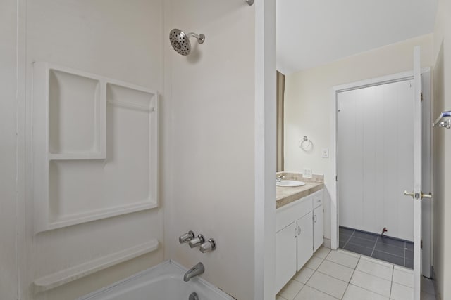 full bath featuring  shower combination, tile patterned flooring, and vanity