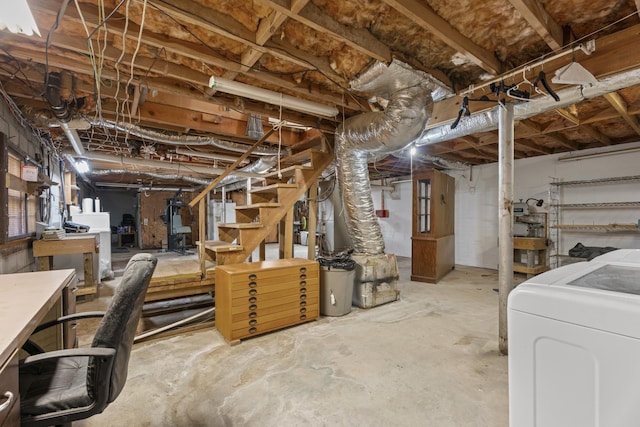 unfinished basement with washer / dryer