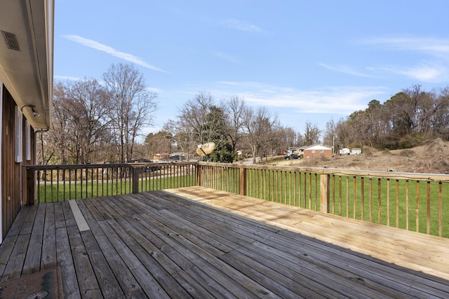 deck featuring a yard