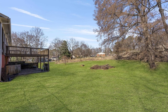 view of yard featuring a wooden deck