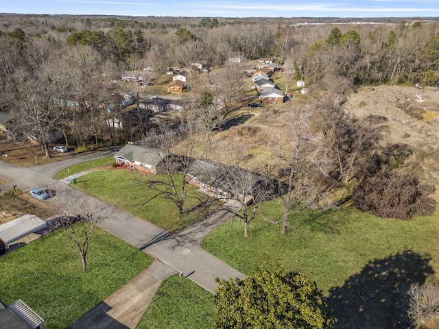 birds eye view of property with a forest view