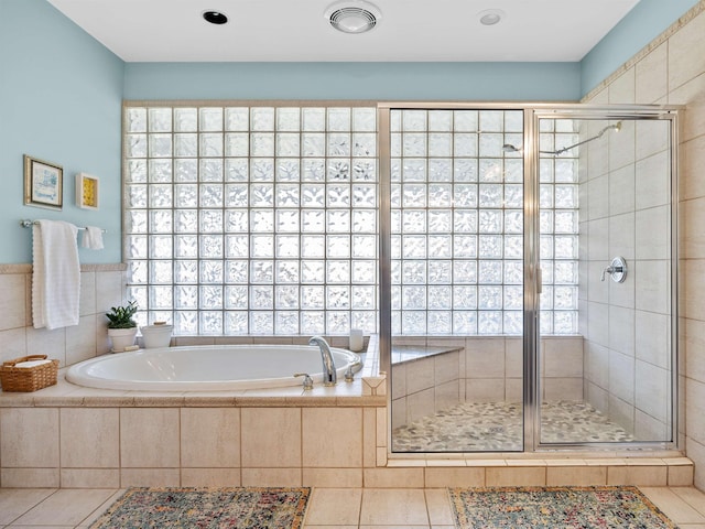 full bath with a garden tub, a shower stall, and a wealth of natural light