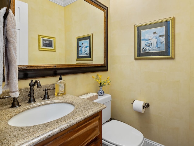 bathroom with toilet and vanity