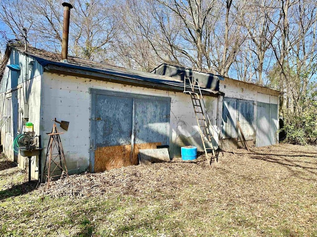 view of side of property featuring concrete block siding