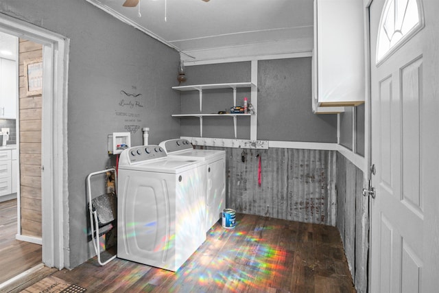 clothes washing area featuring ceiling fan, laundry area, separate washer and dryer, and wood finished floors