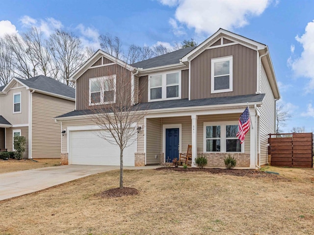 craftsman-style house with board and batten siding, concrete driveway, brick siding, and fence