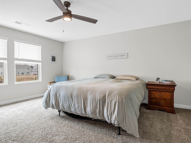 bedroom with carpet, visible vents, ceiling fan, and baseboards