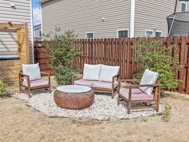 view of patio featuring an outdoor hangout area and a fenced backyard