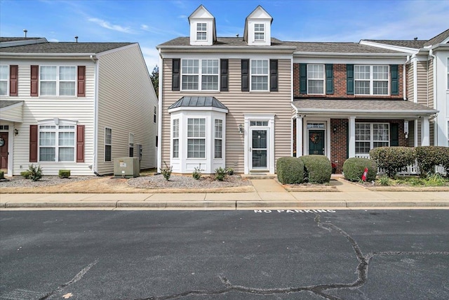 view of front of home with brick siding