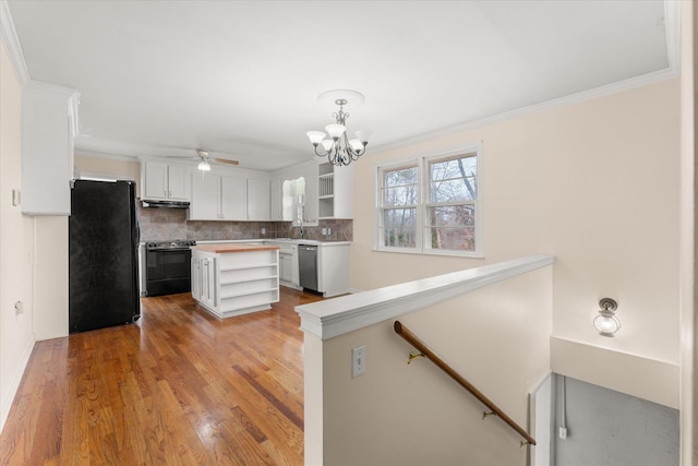 kitchen with open shelves, backsplash, white cabinetry, light wood-type flooring, and black appliances