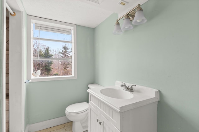 bathroom with tile patterned flooring, visible vents, vanity, and toilet