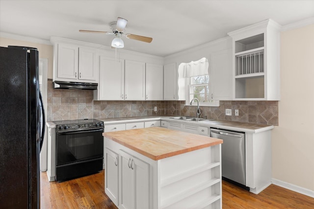 kitchen featuring black appliances, under cabinet range hood, open shelves, and wooden counters