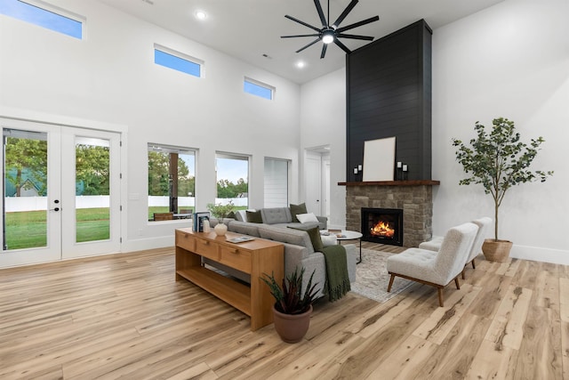 178 Cook, Chesnee, SC 29323 - living area with ceiling fan, a fireplace, french doors, a high ceiling, and light wood finished floors