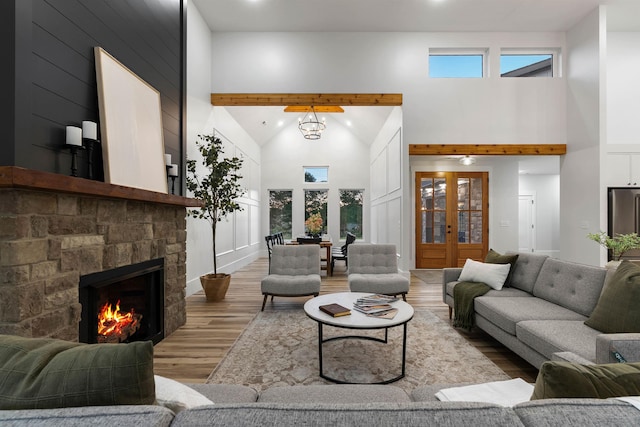 178 Cook, Chesnee, SC 29323 - living area featuring high vaulted ceiling, wood finished floors, healthy amount of natural light, and a stone fireplace