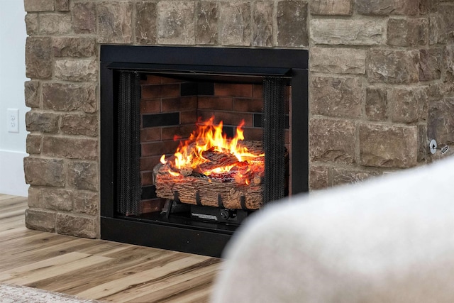 178 Cook, Chesnee, SC 29323 - detailed view of a brick fireplace and wood finished floors