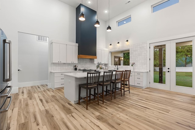 178 Cook, Chesnee, SC 29323 - kitchen with a high ceiling, light countertops, a breakfast bar area, and healthy amount of natural light