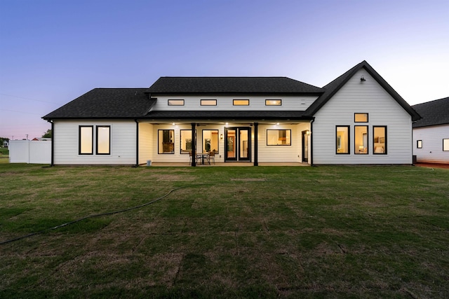 178 Cook, Chesnee, SC 29323 - back of house at dusk featuring ceiling fan, a yard, a patio, and a shingled roof