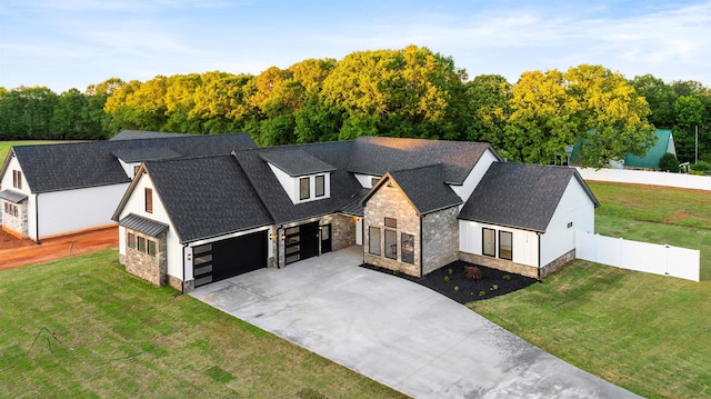 178 Cook, Chesnee, SC 29323 - modern farmhouse featuring stone siding, roof with shingles, concrete driveway, and an attached garage