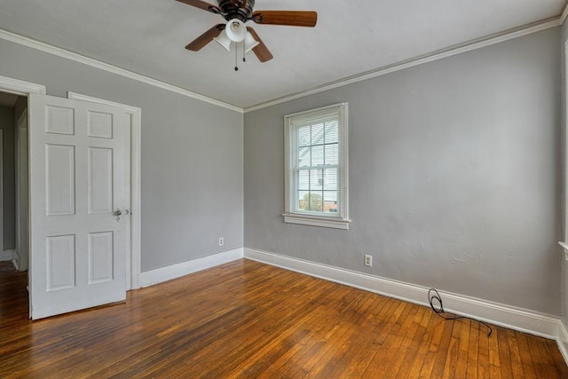 empty room with ornamental molding, ceiling fan, baseboards, and hardwood / wood-style flooring