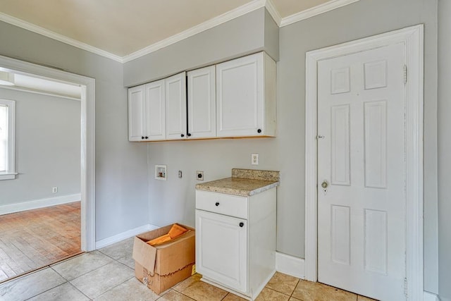 washroom with hookup for a washing machine, crown molding, light tile patterned floors, and hookup for an electric dryer