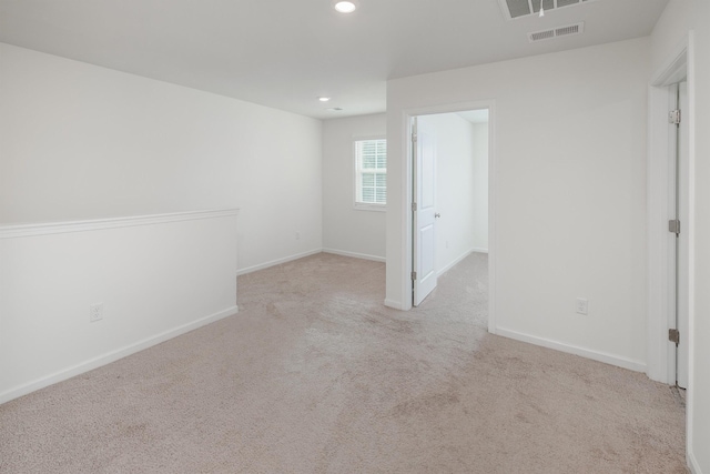 unfurnished room featuring recessed lighting, carpet flooring, visible vents, and baseboards