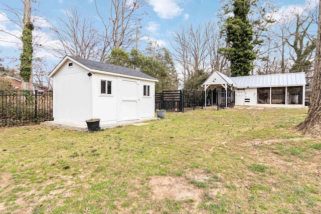 view of yard with an outbuilding and a fenced backyard