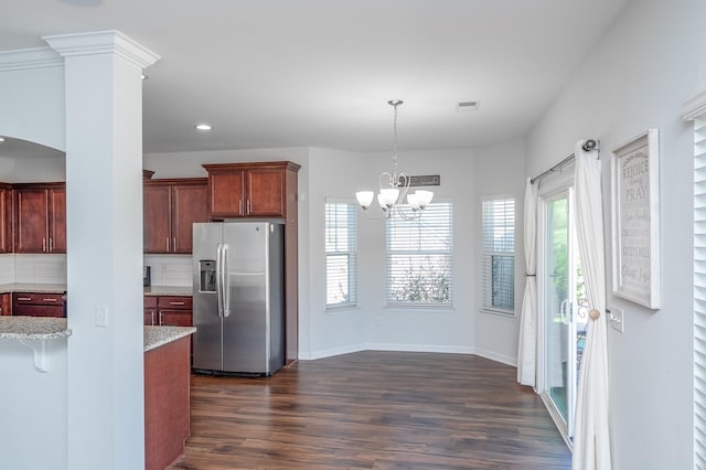 kitchen featuring tasteful backsplash, visible vents, stainless steel fridge with ice dispenser, and dark wood-style floors