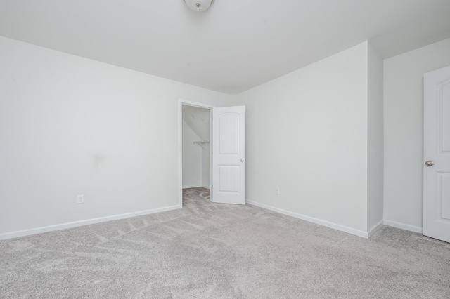 empty room with carpet floors and baseboards