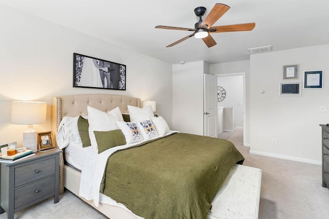 bedroom with light carpet, baseboards, visible vents, and ceiling fan