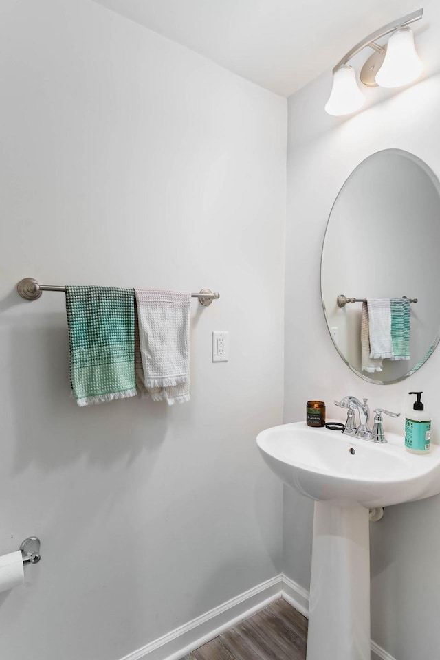 bathroom featuring baseboards and wood finished floors