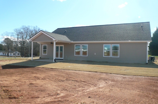 back of house featuring ceiling fan, a patio, and roof with shingles