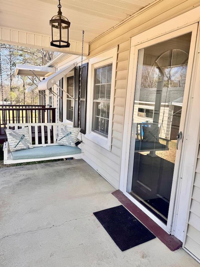 entrance to property featuring a porch