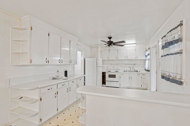 kitchen featuring open shelves, white appliances, and white cabinets