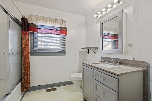 full bathroom with toilet, visible vents, and vanity