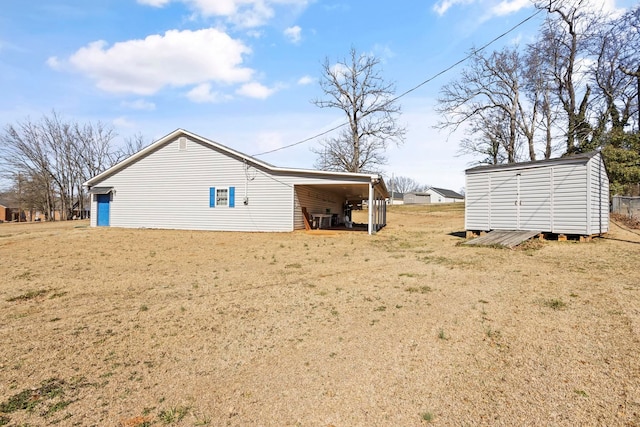 view of home's exterior featuring an outbuilding, dirt driveway, central AC, a shed, and a carport