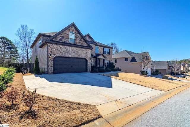 view of front of house with a garage, brick siding, and driveway