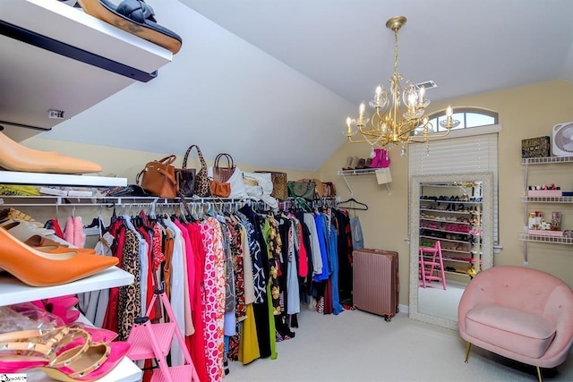 spacious closet featuring lofted ceiling and a notable chandelier