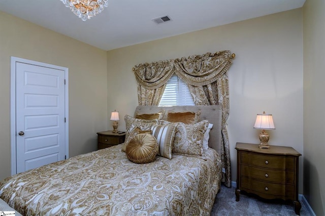 bedroom featuring visible vents, carpet flooring, and an inviting chandelier