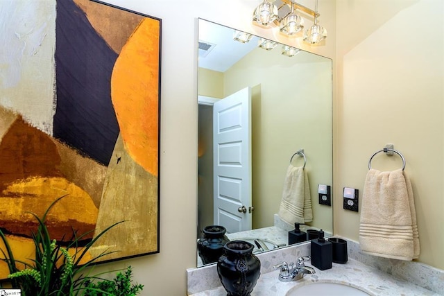 bathroom with visible vents and a sink