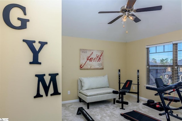 workout room with carpet floors, vaulted ceiling, baseboards, and a ceiling fan