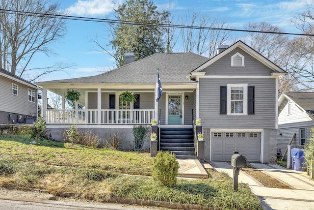 view of front of home featuring a porch, a garage, driveway, roof with shingles, and a chimney